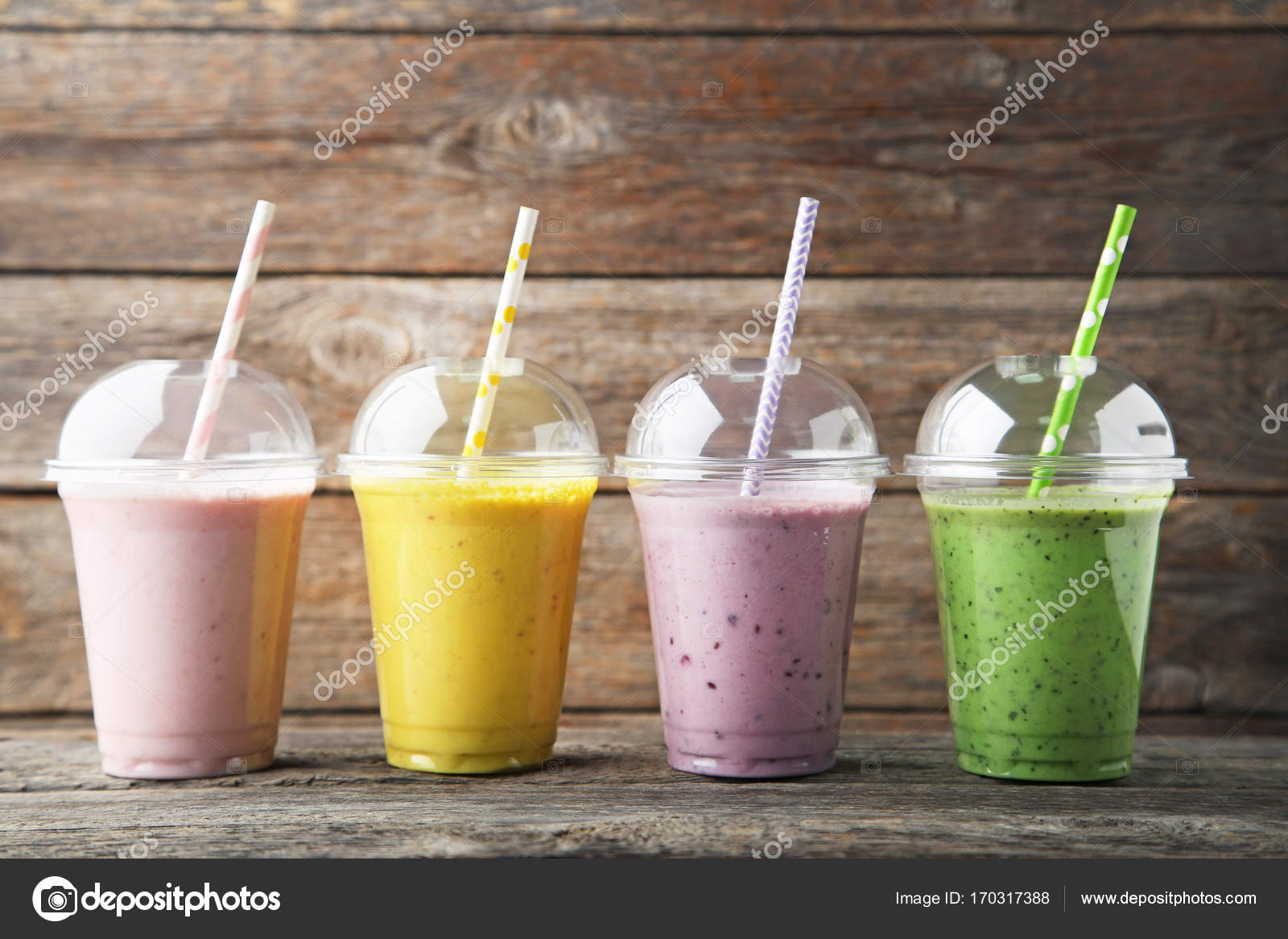 Sweet smoothie in plastic cups — Stock Photo © 5seconds 170317388
