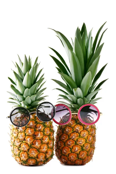 Ripe pineapples with sunglasses — Stock Photo, Image