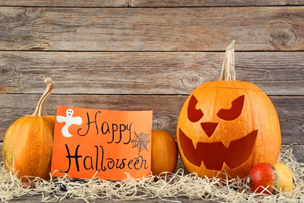 Halloween pumpkins and orange paper — Stock Photo, Image