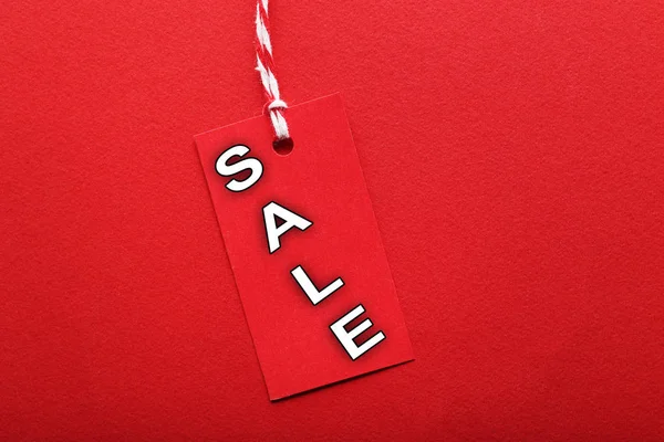 Sale tag on red — Stock Photo, Image