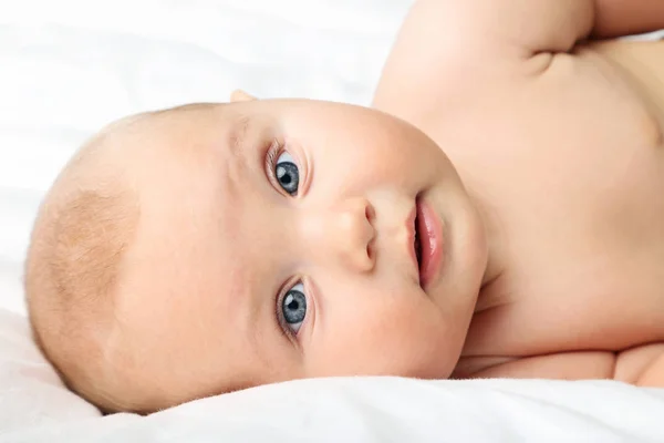 Little newborn baby on white bed — Stock Photo, Image
