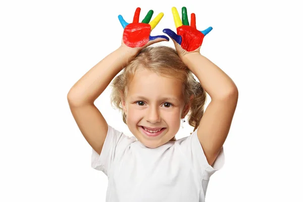 Beautiful little girl with colourful painted hands — Stock Photo, Image