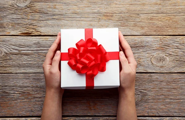 Female hands holding gift box — Stock Photo, Image