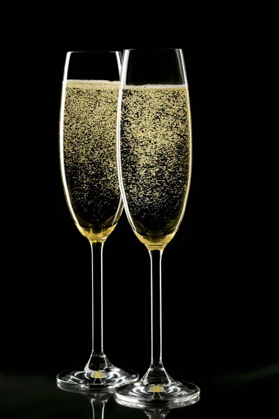 Champagne flute glasses on black background