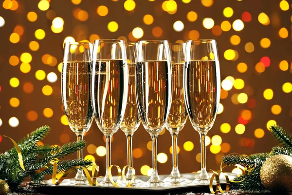 Champagne Glasses Fir Tree Branches Baubles Lights Background — Stock Photo, Image