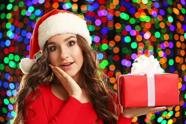 Young Woman Santa Hat Gift Box Lights Background — Stock Photo, Image