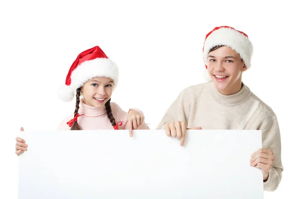 Young girl and boy in santa hats — Stock Photo, Image