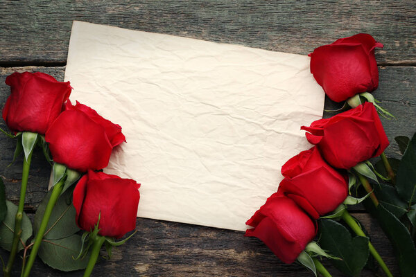 Red roses with blank sheet 