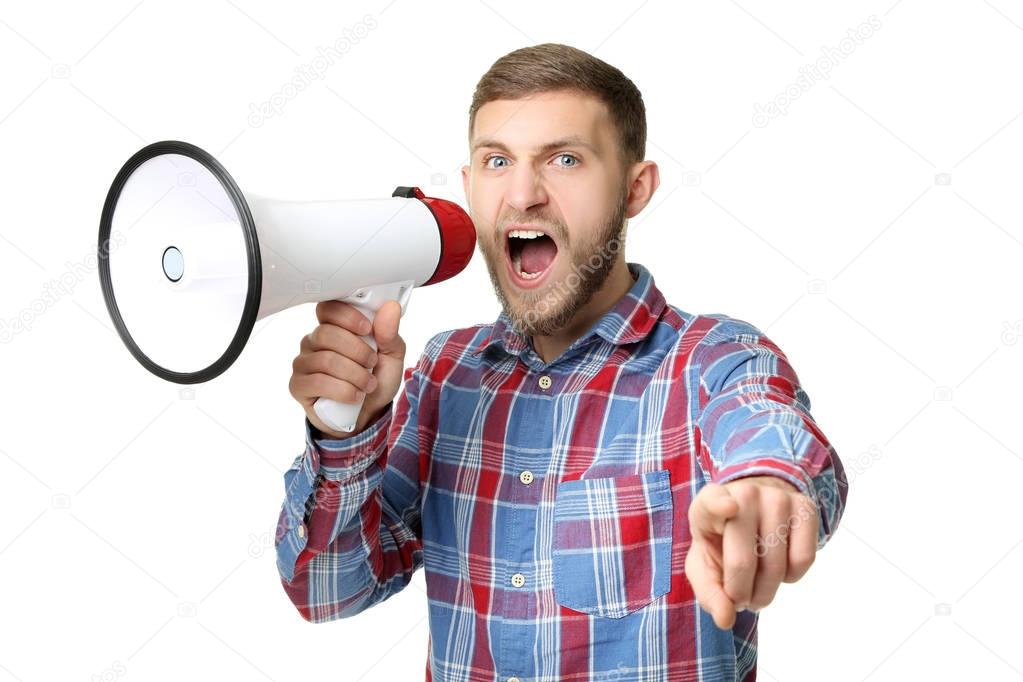 Young man screaming in megaphone