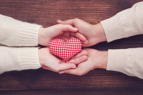 Female Male Hand Holding Red Fabric Heart Brown Background — Stock Photo, Image