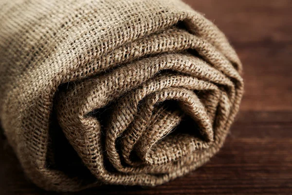 Rolled Sackcloth Brown Wooden Table — Stock Photo, Image