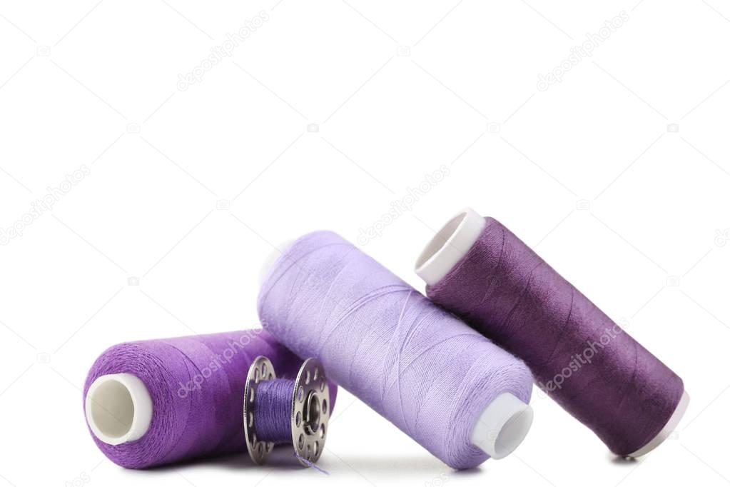 Purple thread spools isolated on a white