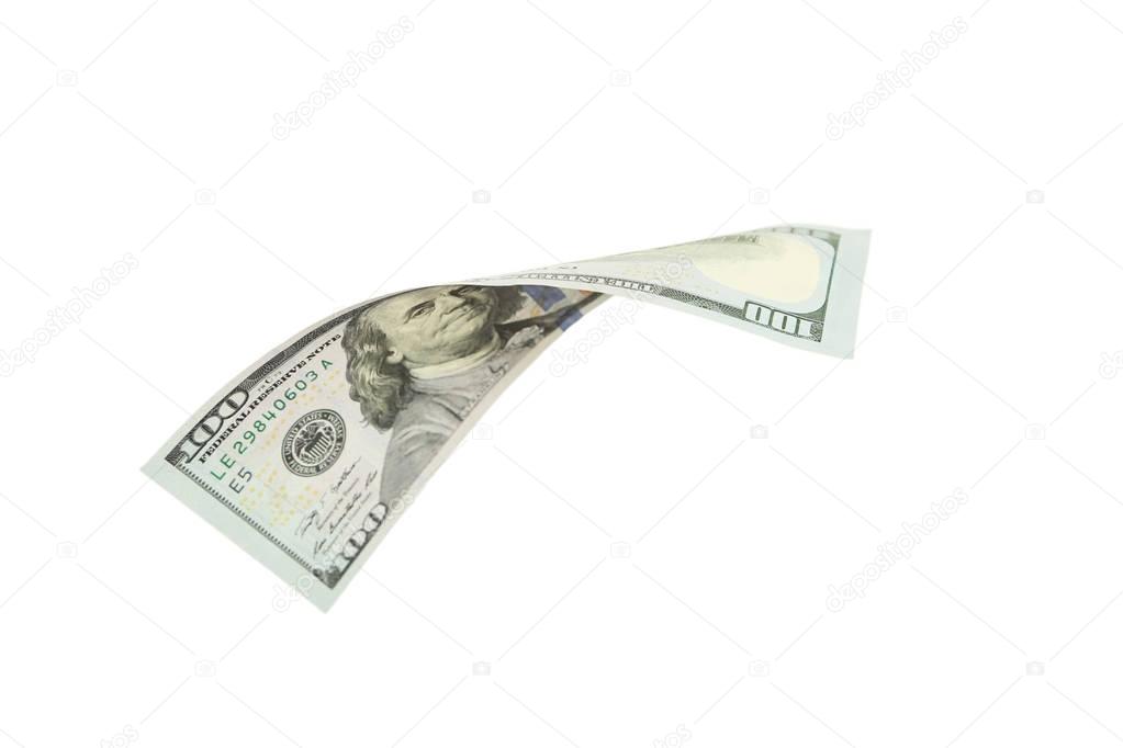 Hundred dollar bill falling on white background