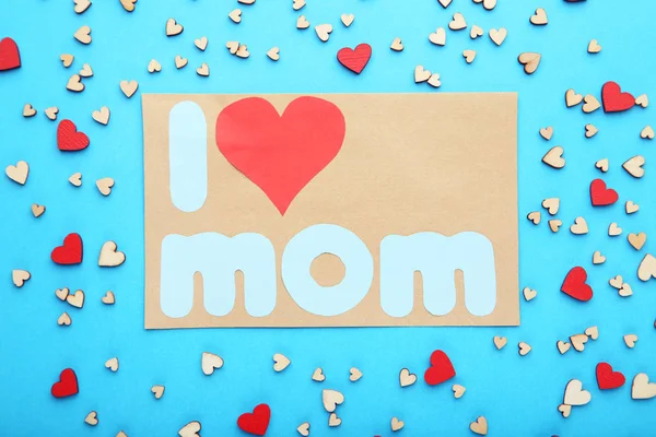 Greeting card with small hearts on blue background