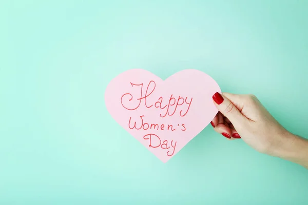 Female Hand Holding Card Inscription Happy Women Day Mint Background — Stock Photo, Image