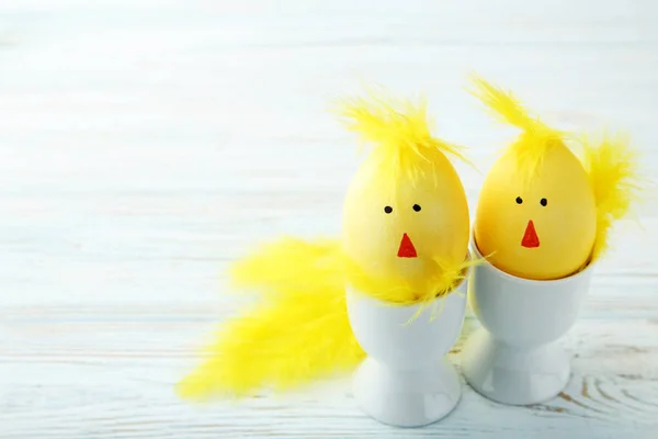 Yellow eggs with funny chicken faces