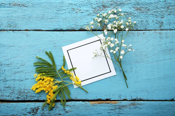 Mimosa Gypsophila Flowers White Greeting Card Blue Wooden Table — Stock Photo, Image