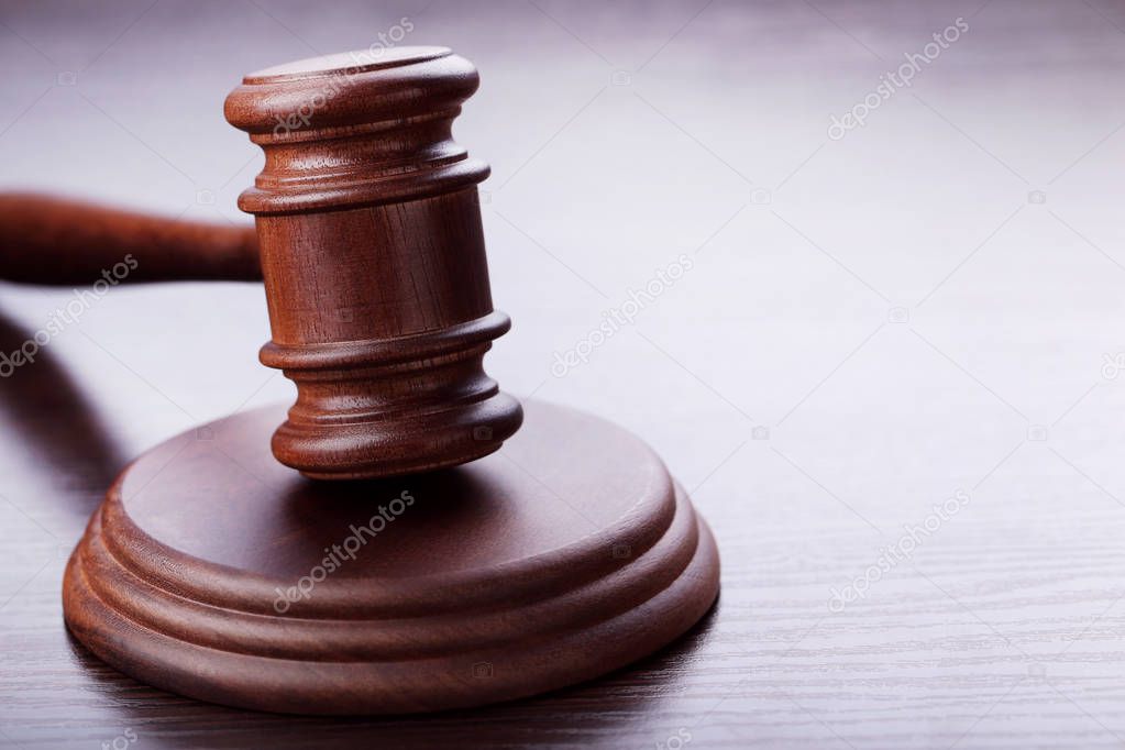 Judge gavel on wooden table