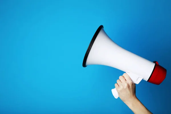 Female Hand Holding Megaphone Blue Background — Stock Photo, Image