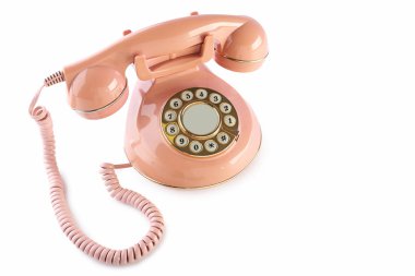 Beyaz izole pembe retro telefon