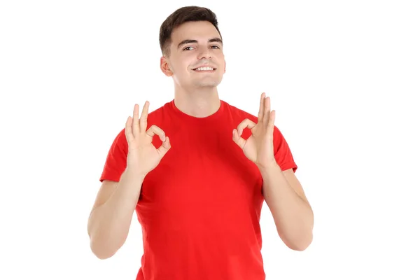 Młody człowiek pokazuje gest Ok na białym tle — Zdjęcie stockowe