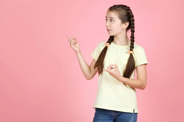 Beautiful young girl on pink background — Stock Photo, Image