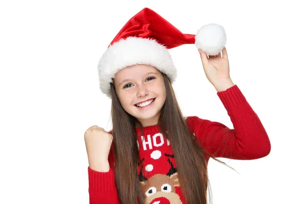Beyaz arka planda izole edilmiş, Noel süveteri ve şapkalı küçük kız. — Stok fotoğraf
