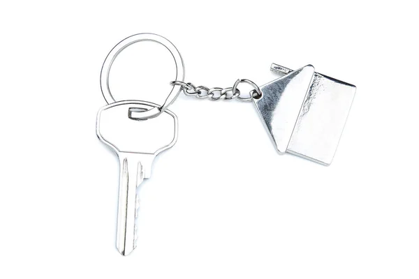 Zilveren sleutel met huis symbool geïsoleerd op witte achtergrond — Stockfoto