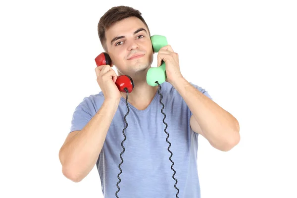 Young man with handsets on white background Royalty Free Stock Photos