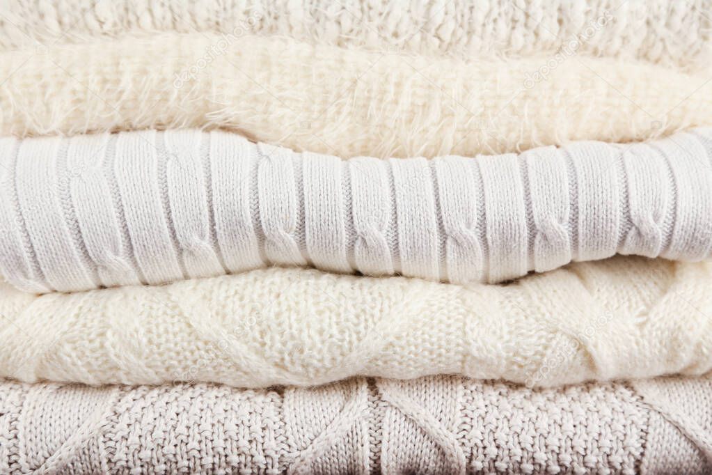 Background of folded knitted sweaters