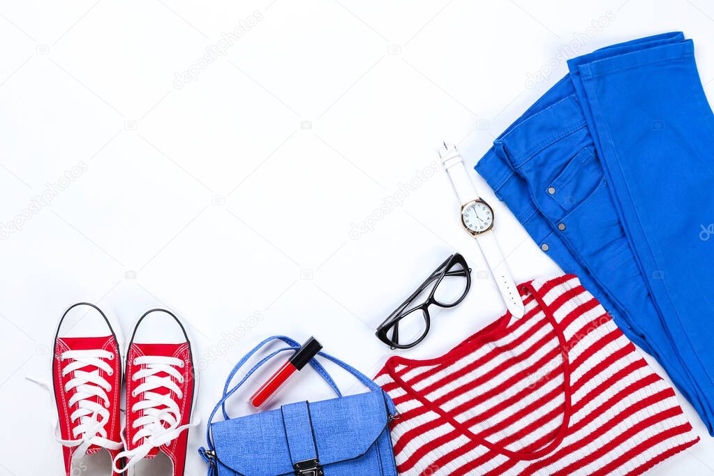 Modern women's clothes with accessories on white background