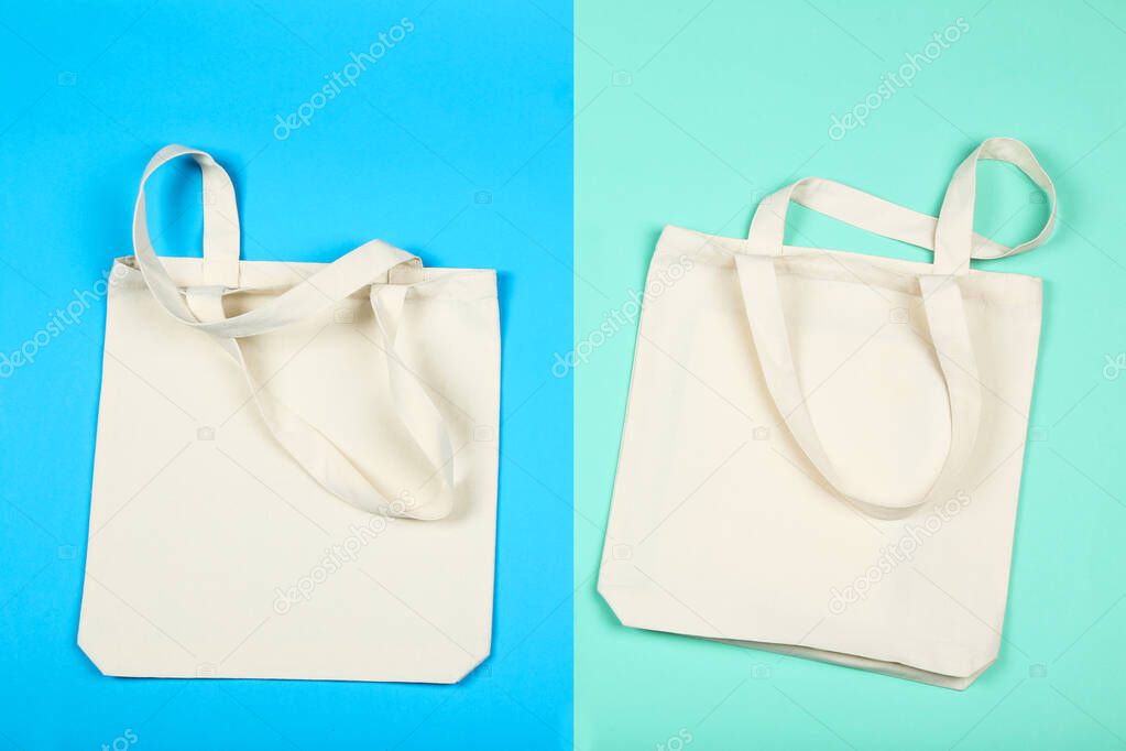 White cotton eco bags on colorful background