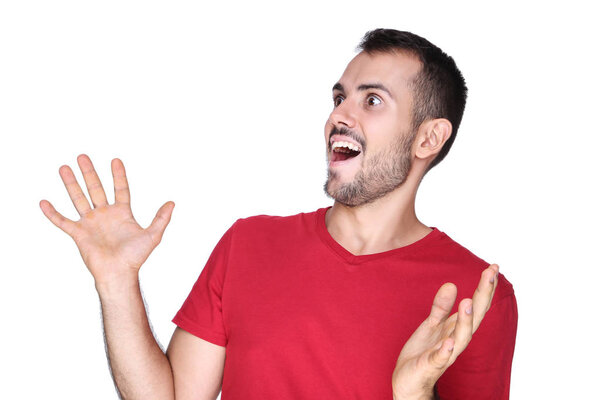 Young surprised man on white background