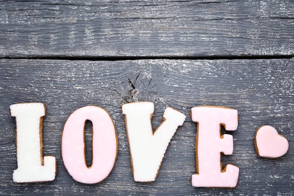 Λέξη Αγάπη Από Μπισκότα Γκρι Ξύλινο Τραπέζι — Φωτογραφία Αρχείου