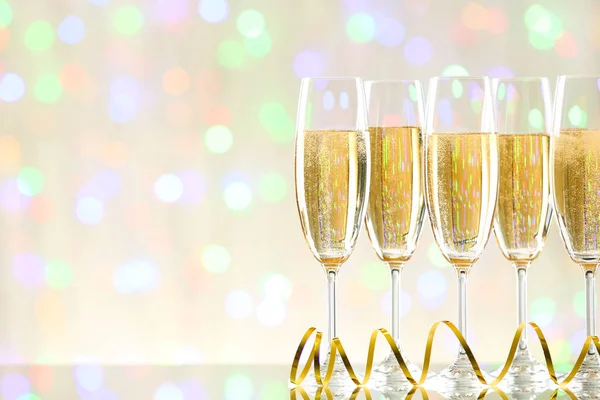 Glasses Champagne Ribbon Blurred Lights Background — Stock Photo, Image