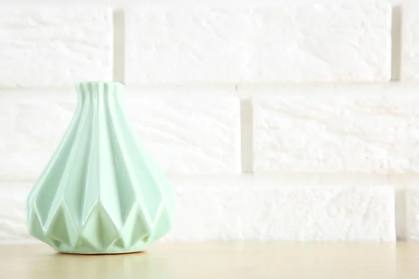 Ceramic vase on white brick wall background — 스톡 사진