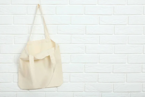 White cotton eco bag on brick wall background — Stock Photo, Image