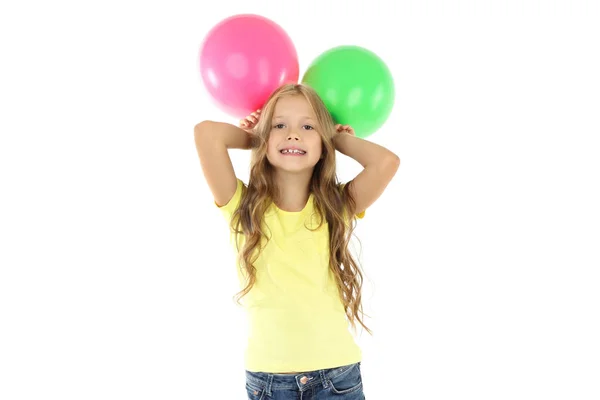 Söt liten flicka med gummi ballonger på vit bakgrund — Stockfoto