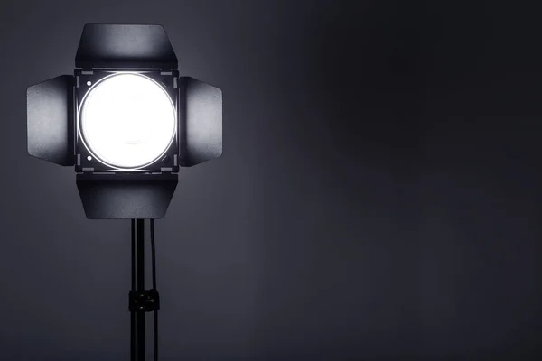 Studio lighting with tripod on black background — Stock Photo, Image