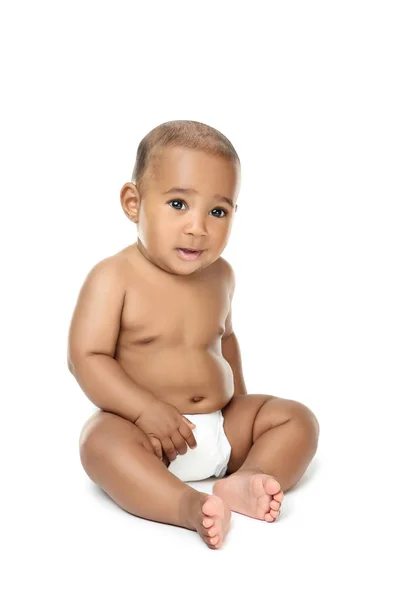 American baby girl sitting on white background — Stock Photo, Image