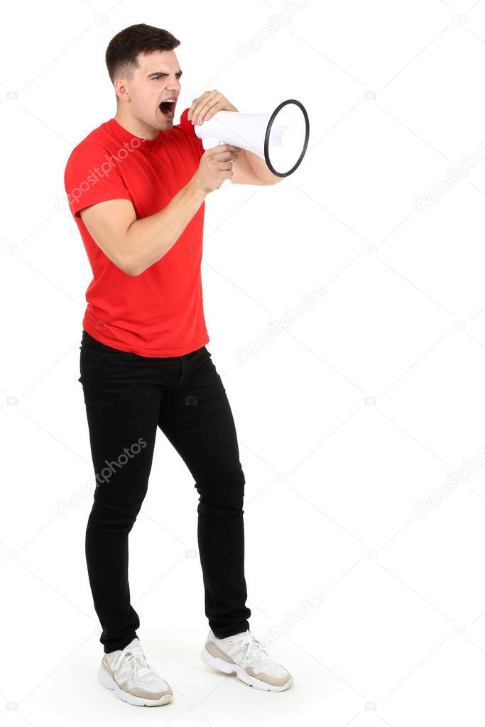 Young man screaming in megaphone on white background