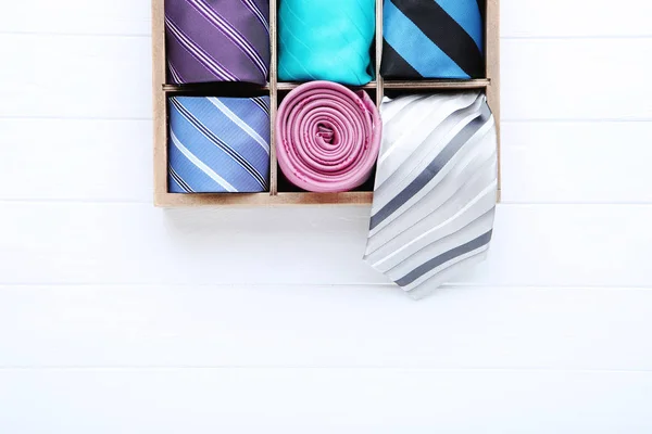 Colored Neckties Basket White Wooden Table — Stock Photo, Image