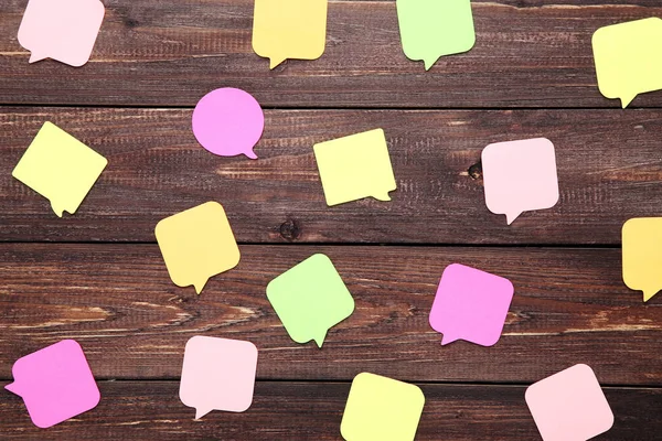 Paper Speech Bubbles Brown Wooden Table — Stock Photo, Image