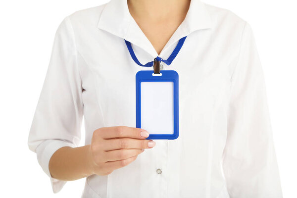 Female hand showing blank bagde on white background