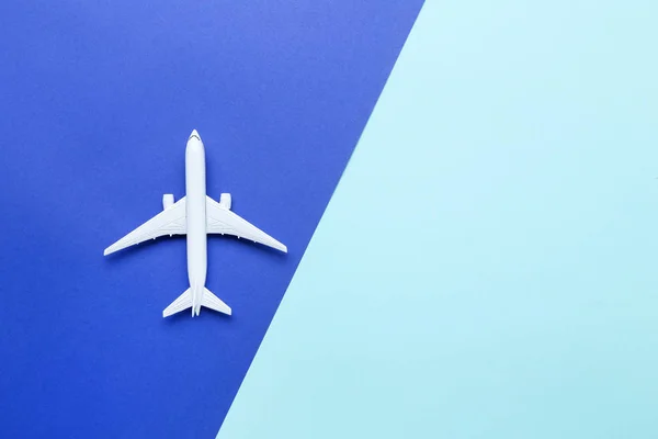 Airplane model on colorful paper background — Stock Photo, Image