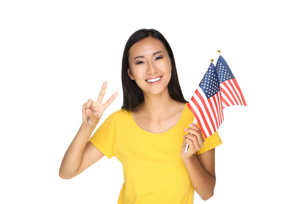 Young woman holding American flag isolated on white background