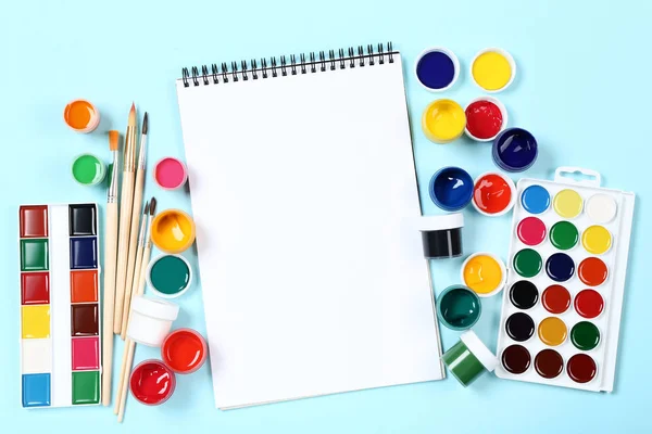 Colorful Gouache Paints Brushes Blank Sheet Paper Blue Background — Stock Photo, Image