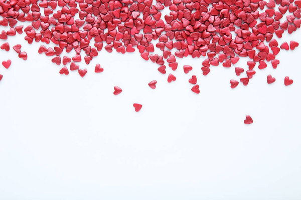 Heart shaped sprinkles on white background