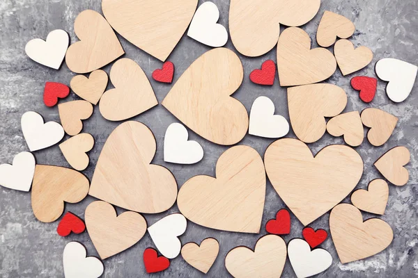 Wooden colorful hearts on grey background — Stock Photo, Image