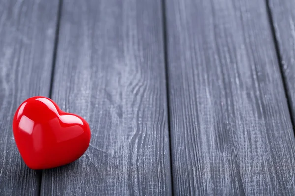 Valentine heart on black wooden background — Stock Photo, Image